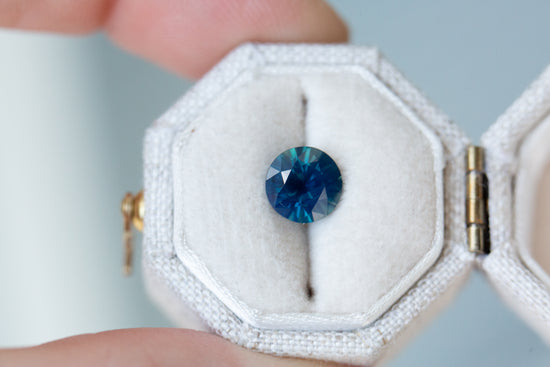 1.65ct round opalescent blue green sapphire