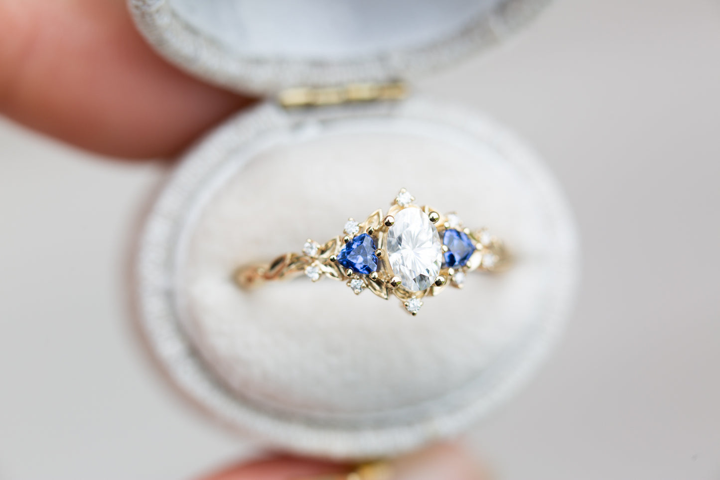 Briar rose three stone with oval moissanite and blue sapphire