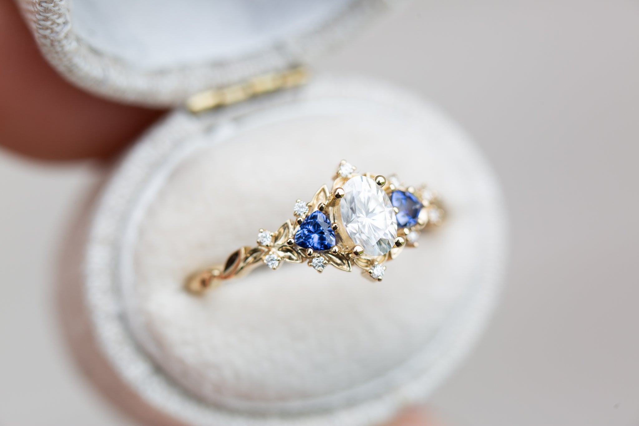 Briar Rose Three Stone with oval moissanite and blue sapphire