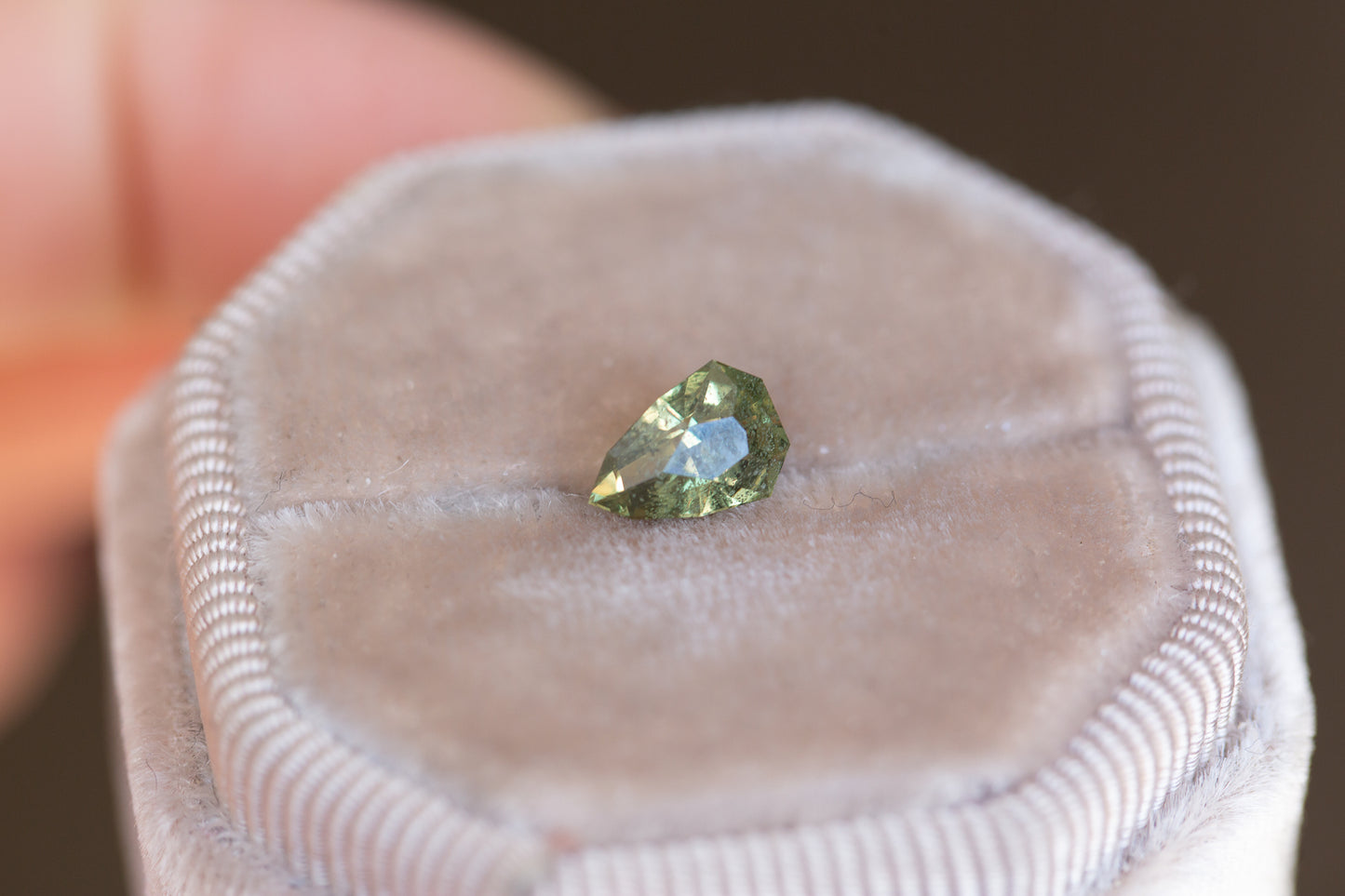 1.25ct olive green pear sapphire