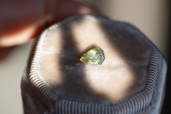 1.25ct olive green pear sapphire
