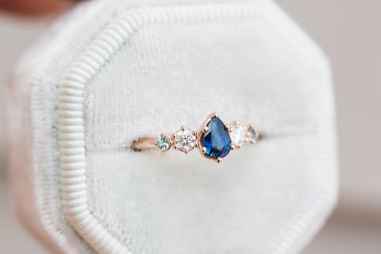 Pear blue sapphire and diamond five stone ring
