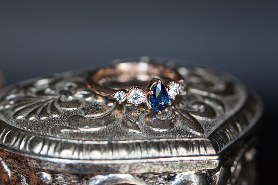Pear blue sapphire and diamond five stone ring