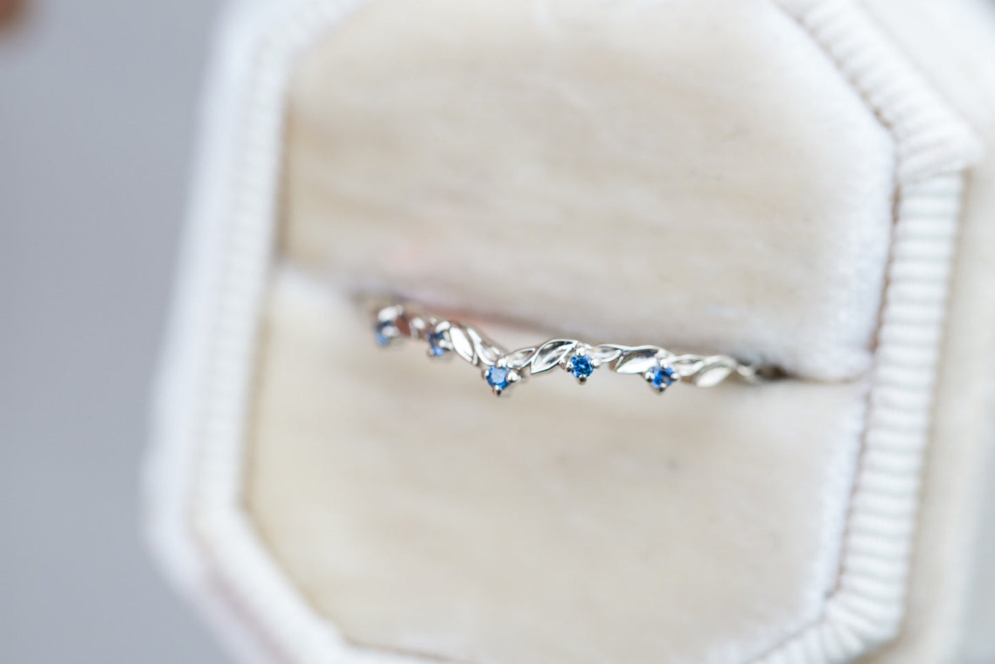 Blue sapphire curved leaf wedding band