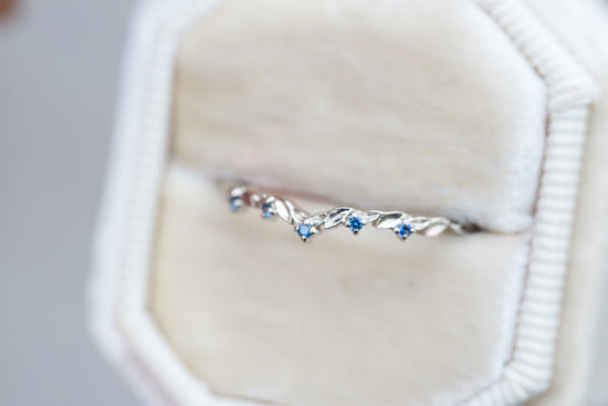 Blue sapphire curved leaf wedding band