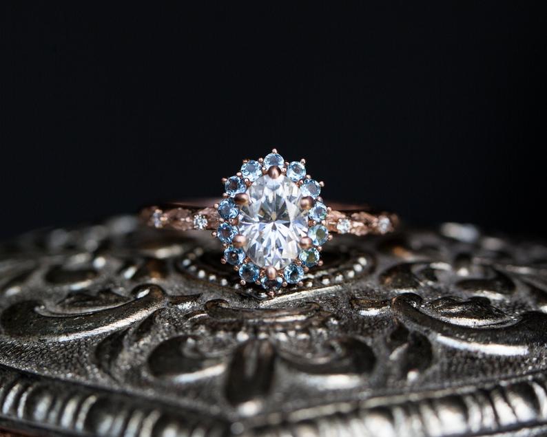 Oval moissanite aquamarine halo leaf engagement ring