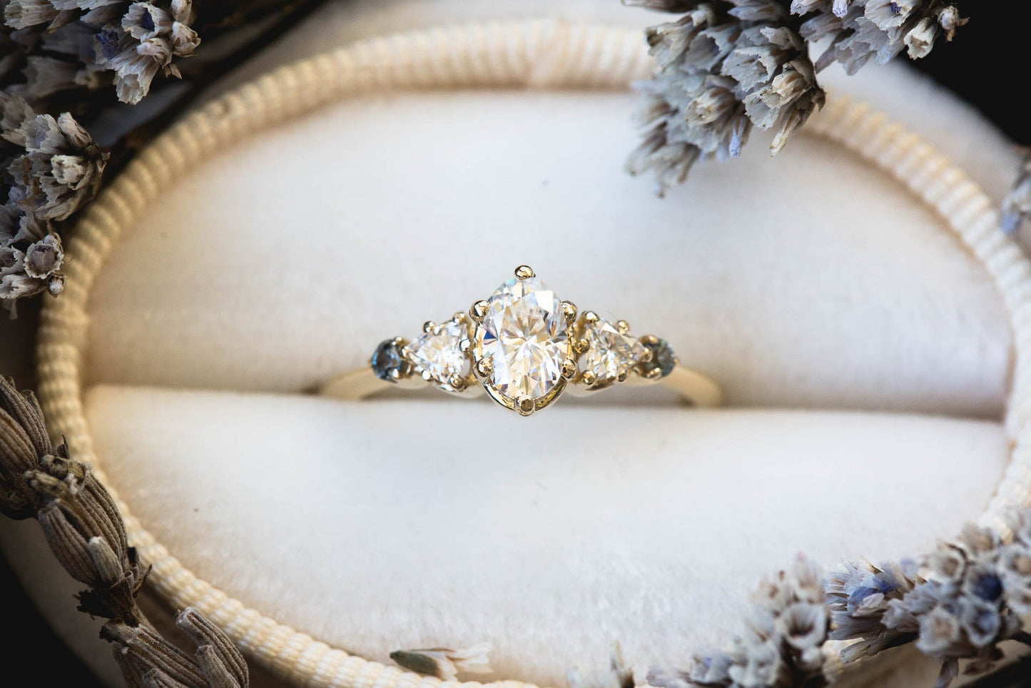 Five stone setting with 6x4mm oval moissanite