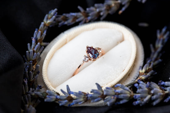 Pear alexandrite and sapphire three stone engagement ring