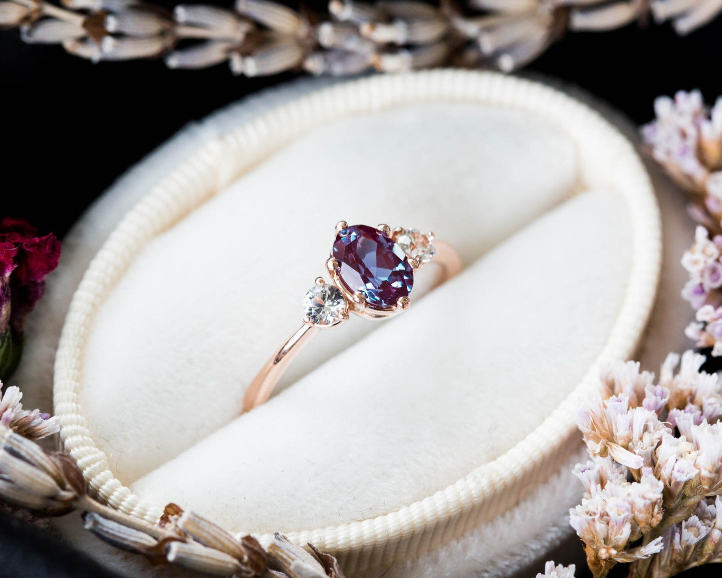 Oval alexandrite and sapphire three stone 14k gold engagement ring