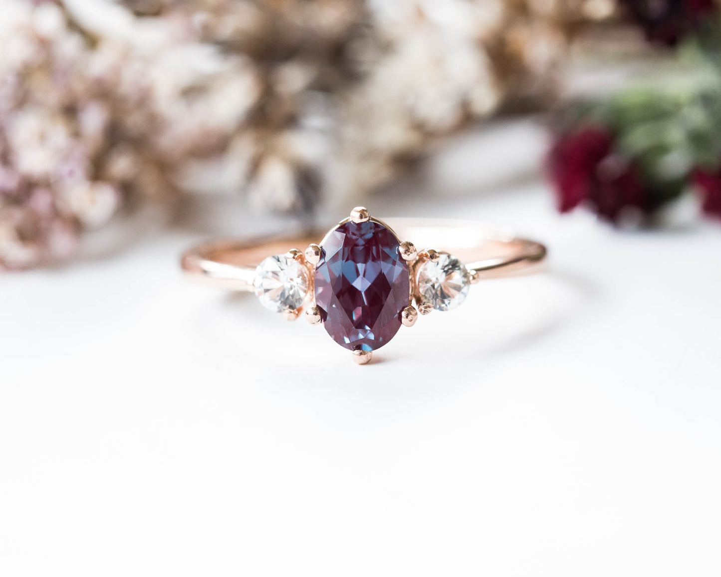 Oval alexandrite and sapphire three stone 14k gold engagement ring