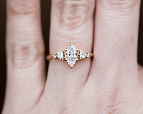 Five stone ring with marquise moissanite