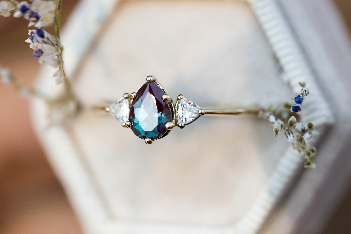 Pear alexandrite moissanite three stone engagement ring