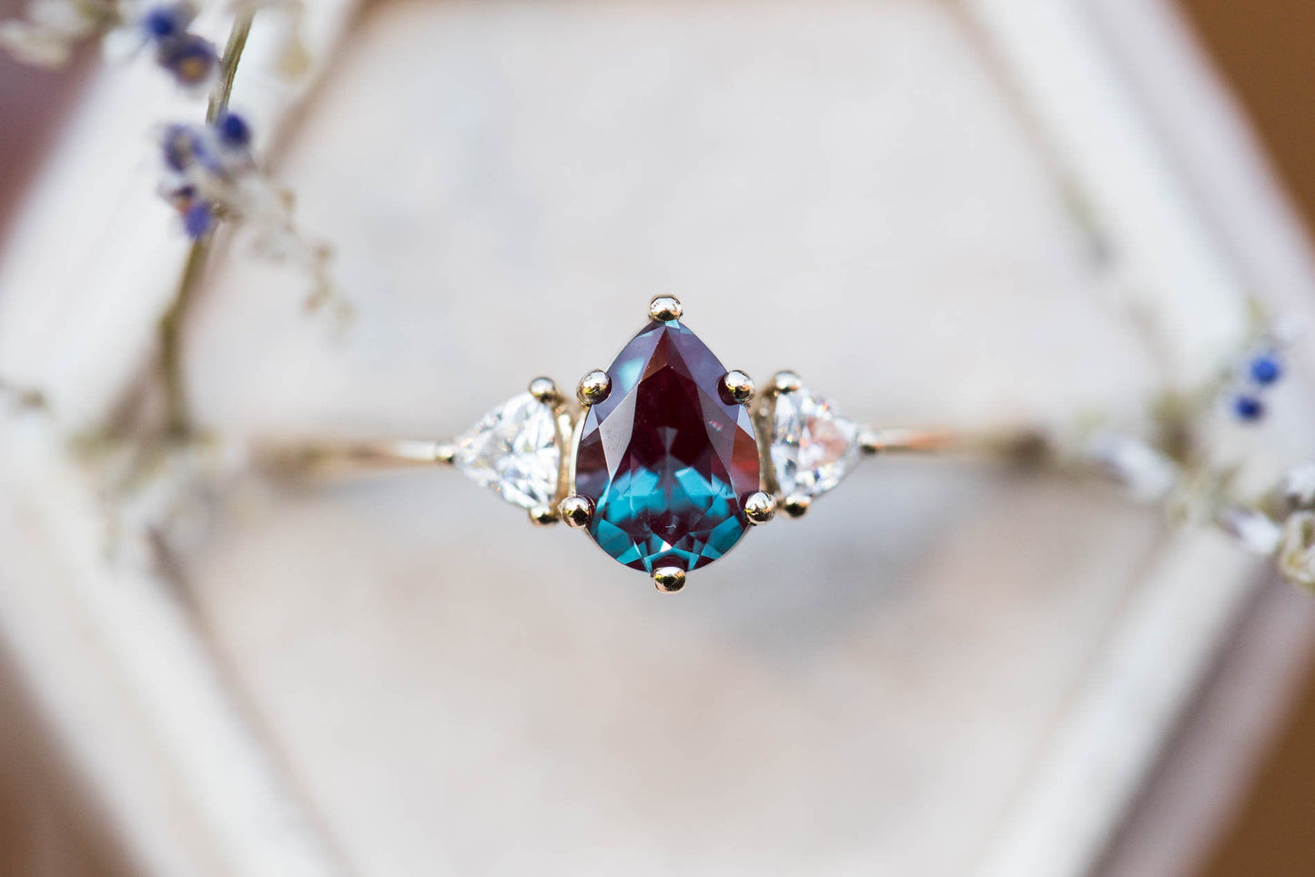 Pear alexandrite moissanite three stone engagement ring