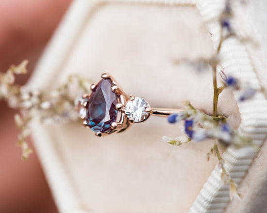 Pear alexandrite and sapphire three stone engagement ring