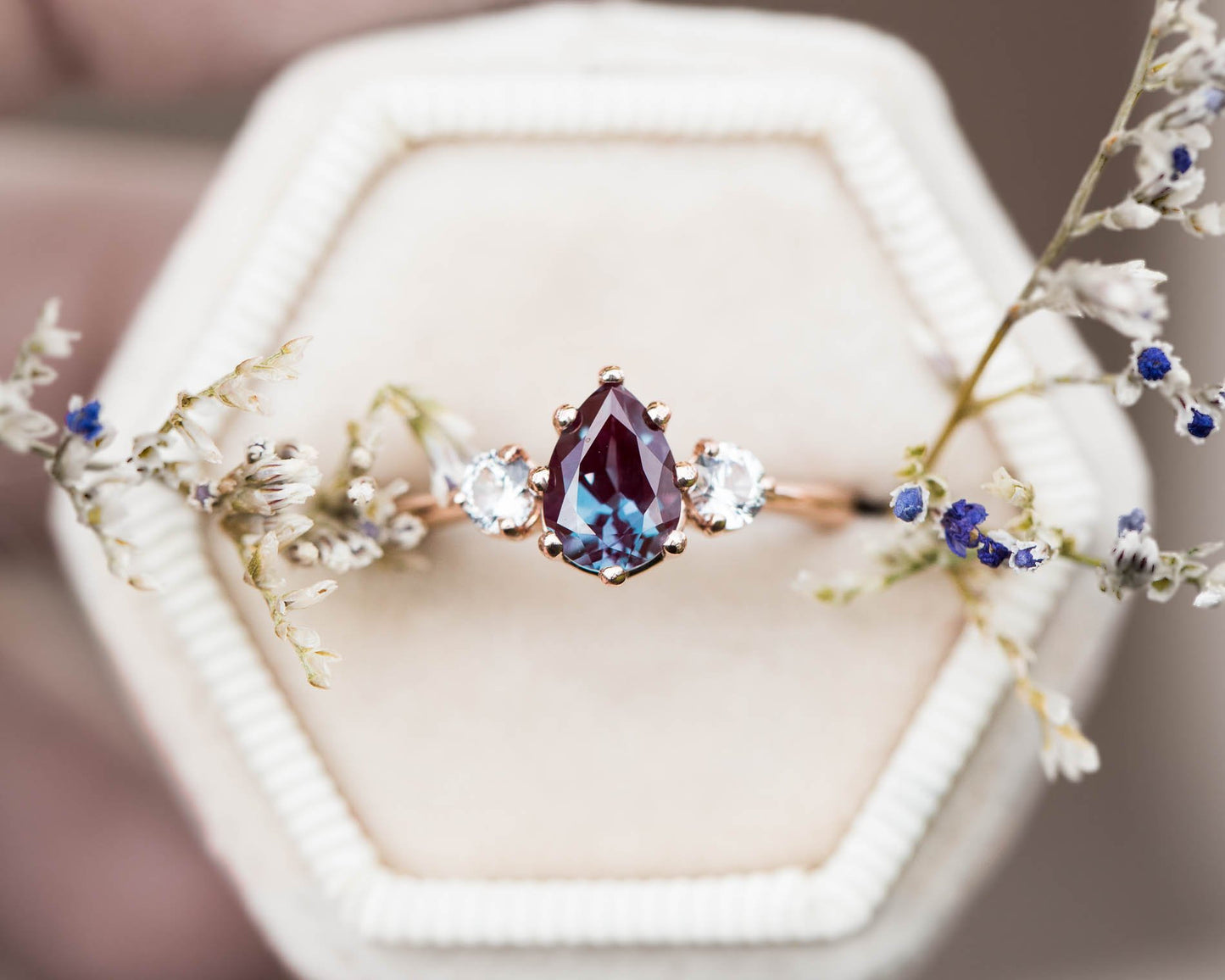 Pear alexandrite and sapphire three stone engagement ring