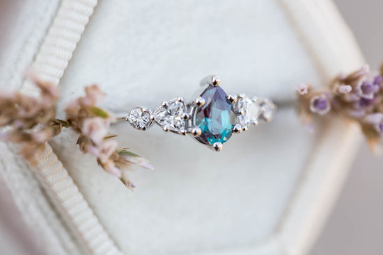 Five stone setting with pear alexandrite and moissanite
