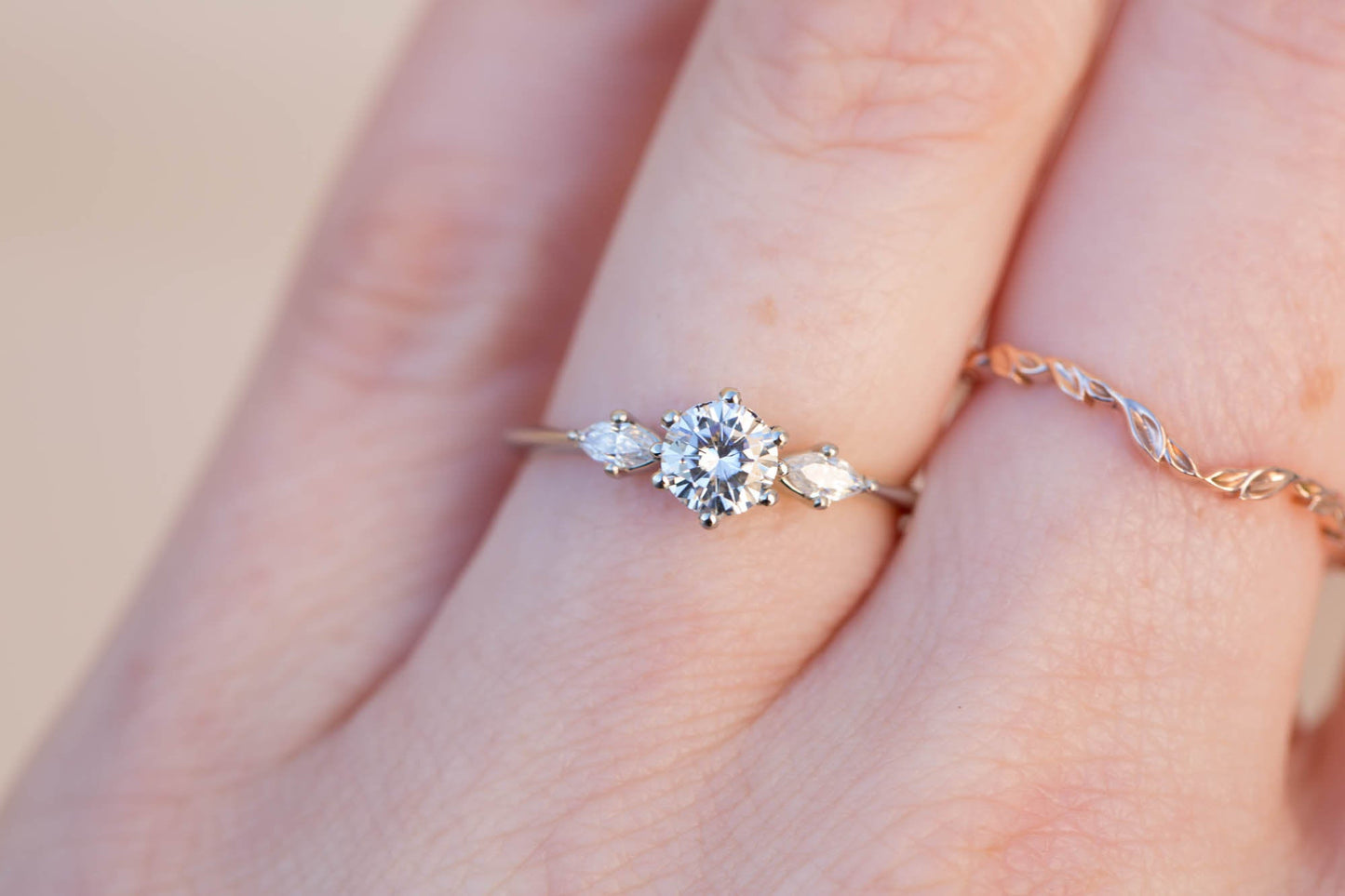 Load image into Gallery viewer, Three stone ring with 5mm round moissanite and marquise side stones
