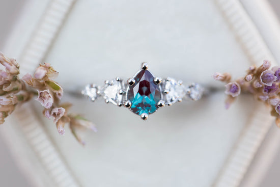 Five stone setting with pear alexandrite and moissanite