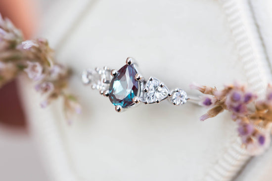 Five stone setting with pear alexandrite and moissanite