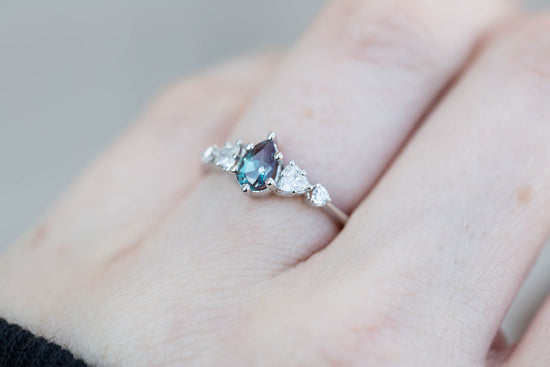 Five stone setting with pear alexandrite and moissanite