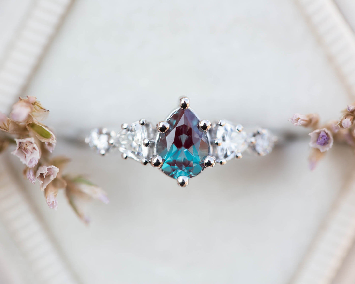 Five stone setting with pear alexandrite and moissanite