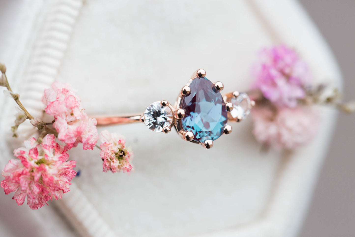 Pear alexandrite and sapphire three stone engagement ring